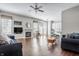 Bright and spacious living room with hardwood floors, a fireplace, and an open floor plan at 11419 Niagara Dr, Fishers, IN 46037