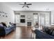 Comfortable living room with hardwood floors, recessed lighting, fireplace and ample natural light at 11419 Niagara Dr, Fishers, IN 46037