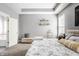 Bright main bedroom with tray ceiling, open bath and white/gray color palette at 11419 Niagara Dr, Fishers, IN 46037