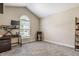 Home office with vaulted ceilings, lots of natural light, carpet and modern black shelving at 11419 Niagara Dr, Fishers, IN 46037