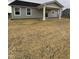 Backyard featuring a covered patio and ample space for outdoor activities at 1193 Brightwood Cir, Greenfield, IN 46140