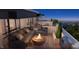 Relaxing rooftop terrace with comfortable seating, fire pit, grill, and beautiful city views at 11940 Citywalk Dr, Fishers, IN 46038