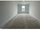 Bedroom with unfinished flooring and one window at 1204 Mcbride St, Greenfield, IN 46140