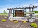 Entrance sign for Brunson's Landing surrounded by shrubbery and stone pillars at 1204 Mcbride St, Greenfield, IN 46140