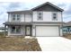 Charming two-story home with gray and white accents and a two-car garage at 1204 Mcbride St, Greenfield, IN 46140