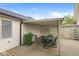 Covered back porch with dining table, chairs, and convenient access to the backyard and house at 12388 Camberley Ln, Carmel, IN 46033