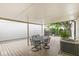 Covered back porch with dining table and chairs, providing a perfect outdoor dining spot at 12388 Camberley Ln, Carmel, IN 46033