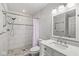 Bright bathroom features a walk-in shower, and vanity with solid surface counter and undermount sink at 12388 Camberley Ln, Carmel, IN 46033