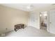 Bedroom with a ceiling fan, double closets, and an ensuite bathroom at 12388 Camberley Ln, Carmel, IN 46033