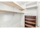Walk-in closet with shelves and ample storage space, designed for optimal organization at 12388 Camberley Ln, Carmel, IN 46033