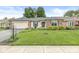 Charming ranch-style home with a well-manicured lawn and inviting curb appeal in a peaceful neighborhood at 12388 Camberley Ln, Carmel, IN 46033