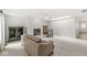 Spacious living room with fireplace, neutral colors, fan, and lots of natural light at 12388 Camberley Ln, Carmel, IN 46033