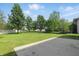 Large backyard featuring a manicured lawn, mature trees and privacy fence at 12409 Dellfield W Blvd, Carmel, IN 46033