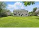Expansive backyard featuring a lush green lawn, perfect for outdoor activities and relaxation at 12409 Dellfield W Blvd, Carmel, IN 46033
