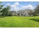 Spacious backyard offers ample green space and privacy for outdoor activities and relaxation at 12409 Dellfield W Blvd, Carmel, IN 46033