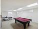 Finished basement with ping pong table and pool table at 12409 Dellfield W Blvd, Carmel, IN 46033