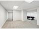 Finished basement with neutral carpeting, neutral walls and a pool table at 12409 Dellfield W Blvd, Carmel, IN 46033