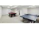 Finished basement with a ping pong table and pool table at 12409 Dellfield W Blvd, Carmel, IN 46033