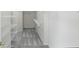 Walk-in closet featuring metal shelving and neutral carpeting at 12409 Dellfield W Blvd, Carmel, IN 46033