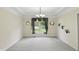The expansive dining room features a tray ceiling and a large window for natural light at 12409 Dellfield W Blvd, Carmel, IN 46033