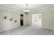 Spacious dining area showcasing modern chandelier and ample natural light at 12409 Dellfield W Blvd, Carmel, IN 46033