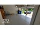 Two-car garage featuring epoxy flooring and open garage door at 12409 Dellfield W Blvd, Carmel, IN 46033
