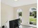 Bright home office with dual windows offering exterior views and a white desk at 12409 Dellfield W Blvd, Carmel, IN 46033