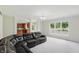 Spacious living room features a large window with backyard view and an open floor plan at 12409 Dellfield W Blvd, Carmel, IN 46033