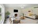 Inviting living room with a fireplace, comfortable seating, and a calming neutral color palette at 12409 Dellfield W Blvd, Carmel, IN 46033