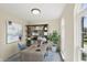 Serene home office featuring neutral walls, carpet, shelving, large window and a work desk at 12409 Dellfield W Blvd, Carmel, IN 46033