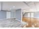 Spacious finished basement with modern flooring, sliding door, and plenty of room for activities at 12469 Springmill Rd, Carmel, IN 46032