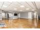 Spacious basement with hardwood floors, recessed lighting, and a kitchenette at 12469 Springmill Rd, Carmel, IN 46032