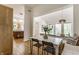 Dining area featuring a kitchen view and a dining table with a comfortable bench seat at 12469 Springmill Rd, Carmel, IN 46032