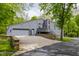 Beautifully designed home featuring a blend of modern aesthetics and natural surroundings, complete with a garage at 12469 Springmill Rd, Carmel, IN 46032