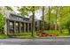 Beautiful home featuring stone accents, large windows, and lush landscaping offering great curb appeal in a serene environment at 12469 Springmill Rd, Carmel, IN 46032