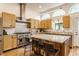 Spacious kitchen featuring stainless steel appliances, an island with a granite countertop, and ample cabinet space at 12469 Springmill Rd, Carmel, IN 46032