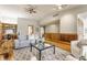 Comfortable living room with hardwood floors, stone fireplace, and stylish furniture offering a cozy and elegant living space at 12469 Springmill Rd, Carmel, IN 46032