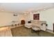Finished basement with seating area, rug, table, and neutral colored walls at 1310 Kings Cove Ct, Indianapolis, IN 46260