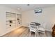 Finished basement with bookshelves, a table, modern flooring, and natural lighting at 1310 Kings Cove Ct, Indianapolis, IN 46260