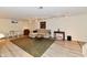 Finished basement with seating area, table, rug, natural lighting, and neutral colored walls at 1310 Kings Cove Ct, Indianapolis, IN 46260