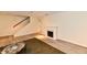 Finished basement with stairs, fireplace, modern flooring, and neutral colored walls at 1310 Kings Cove Ct, Indianapolis, IN 46260