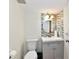 Stylish half-bathroom features a modern vanity and mosaic tile backsplash at 1310 Kings Cove Ct, Indianapolis, IN 46260