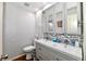 Modern bathroom featuring double sinks and a decorative tile backsplash at 1310 Kings Cove Ct, Indianapolis, IN 46260