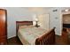 Comfortable bedroom featuring a classic wooden bed frame and closet at 1310 Kings Cove Ct, Indianapolis, IN 46260