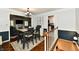 Formal dining room with table, chairs, and decorative accent wall at 1310 Kings Cove Ct, Indianapolis, IN 46260