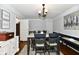 Elegant dining area with modern chandelier and seating for four at 1310 Kings Cove Ct, Indianapolis, IN 46260