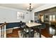 Elegant dining room with hardwood floors, stylish table, and open layout at 1310 Kings Cove Ct, Indianapolis, IN 46260