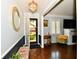 Bright entryway featuring a decorative chandelier and an open front door at 1310 Kings Cove Ct, Indianapolis, IN 46260