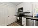 Bright kitchen featuring stainless steel appliances and sleek white cabinets at 1310 Kings Cove Ct, Indianapolis, IN 46260