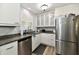 Contemporary kitchen featuring granite countertops and stainless steel appliances at 1310 Kings Cove Ct, Indianapolis, IN 46260